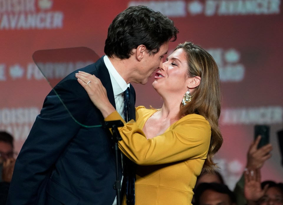  Liberal leader Justin Trudeau and wife Sophie Gregoire Trudeau kiss as they celebrate on stage