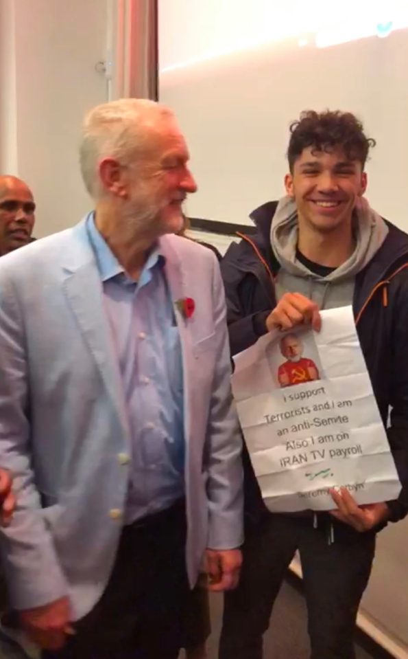  Labour leader Jeremy Corbyn was outwitted at an event at Gloucester University when a 15-year-old boy tricked him into singing an anti-Corbyn poster