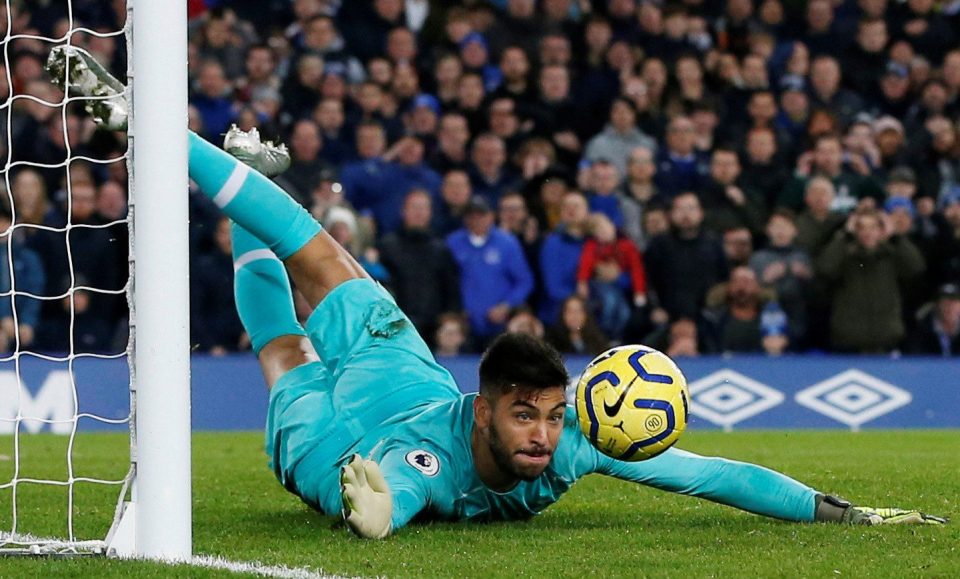 Tottenham keeper Paulo Gazzaniga pulls off a full-stretch save at Goodison Park.