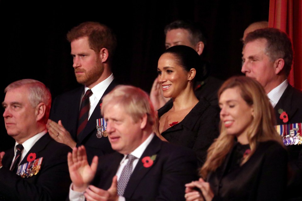  Meghan and Harry sat just above Prime Minister Boris Johnson and his partner Carrie Symonds