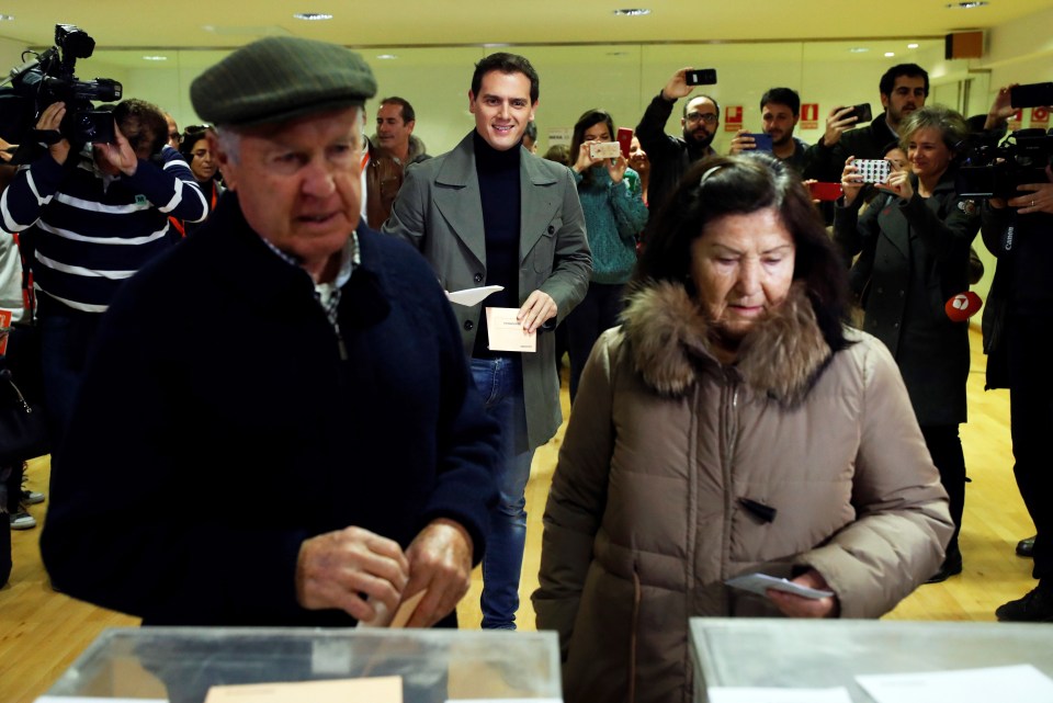  Leader of Spanish Ciudadanos Party Albert Rivera (centre, back) waits for his turn to cast his vote at a polling station in Pozuelo de Alarcon, Madrid, Spain, November 10