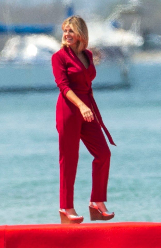  The TV presenter wore an eye-catching jumpsuit in jungle red