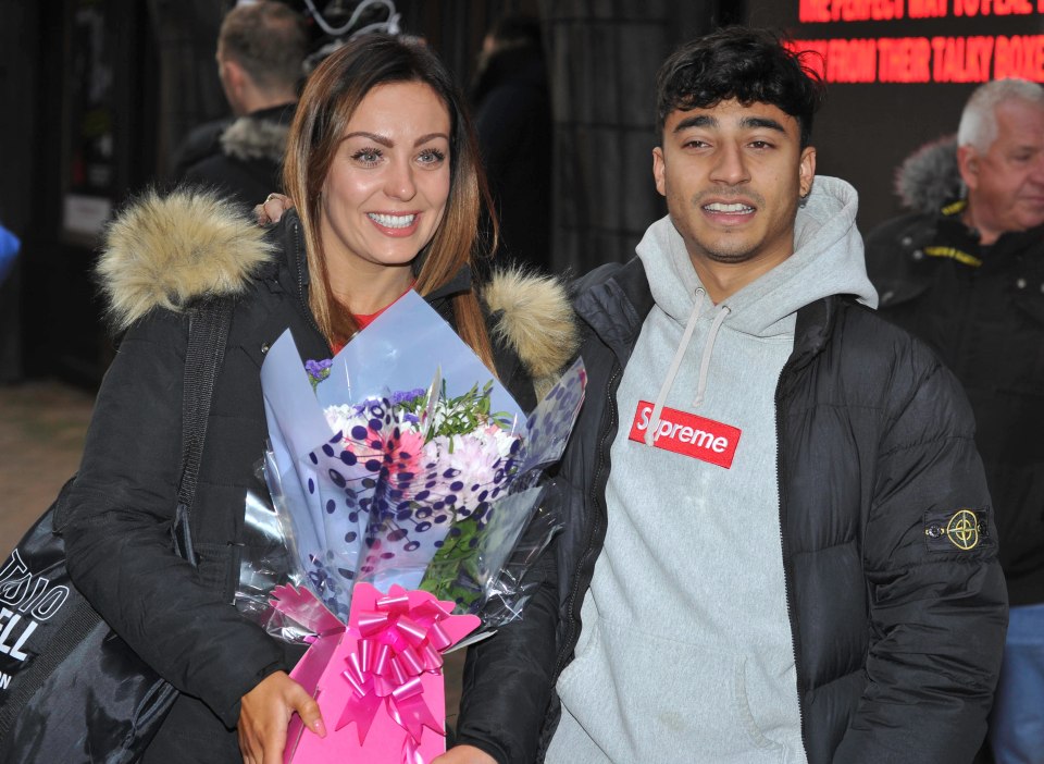  Karim and Amy toted some flowers from a fan