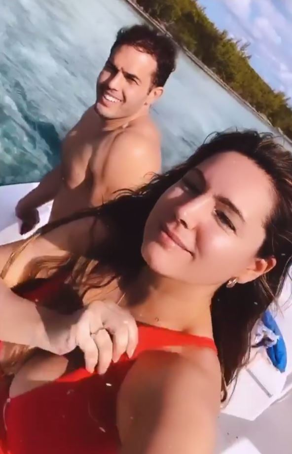  Kelly fixed her red swimsuit as she continued filming their exploits in the Bahamas