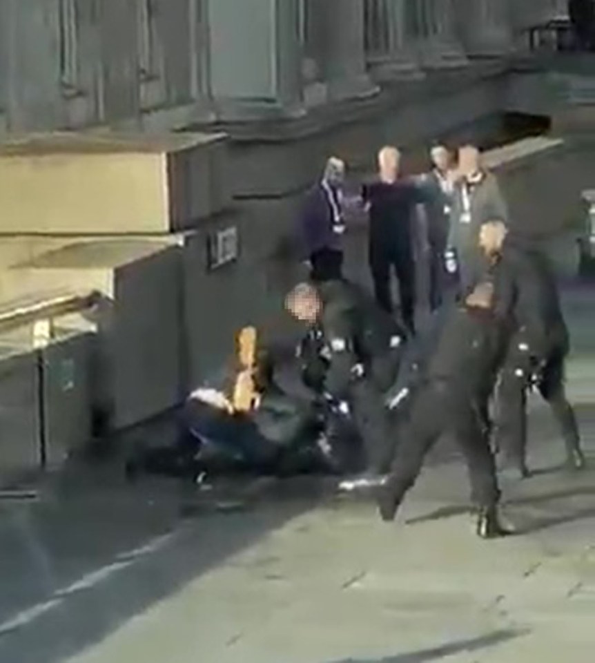 Bystanders held the man down as police raced towards him