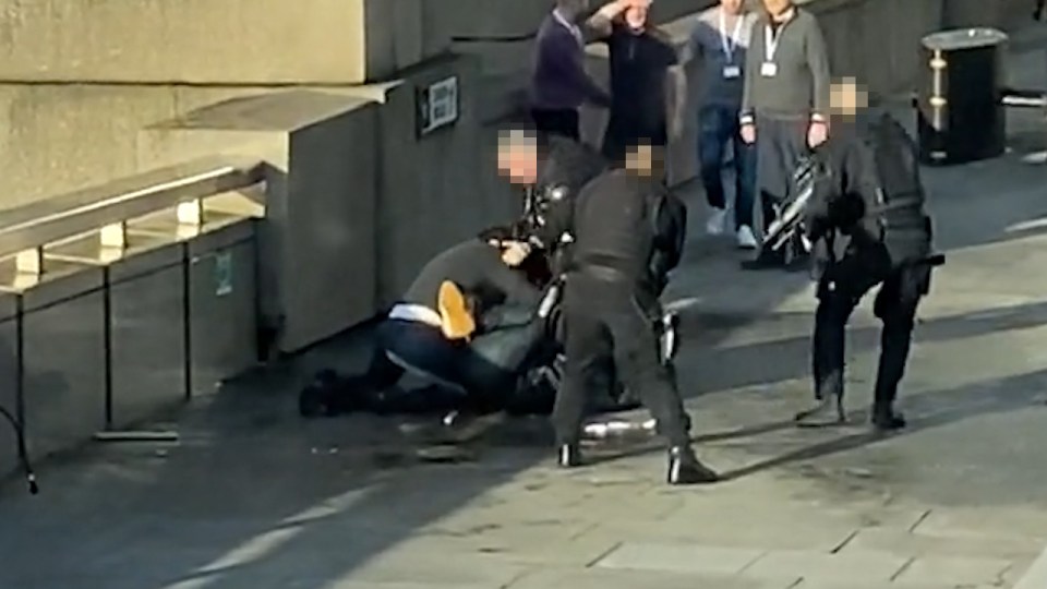  This hero spares no thought for his own safety as armed cops surround the suspect