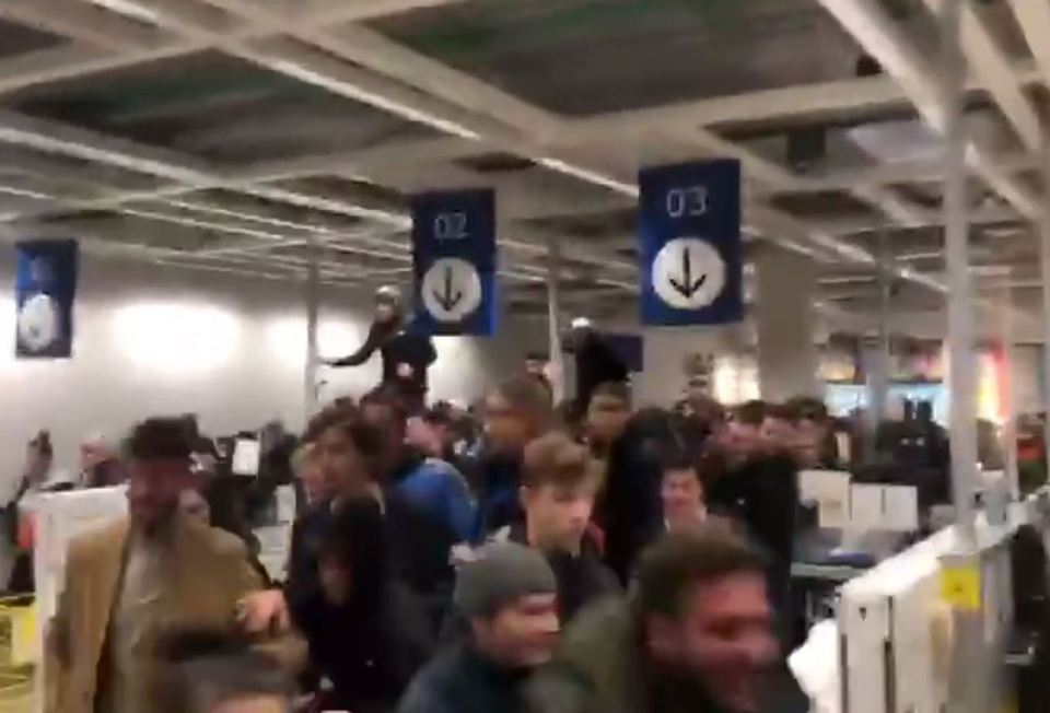  And one overly keen shopper jumped on to the checkout counters to beat the crowd