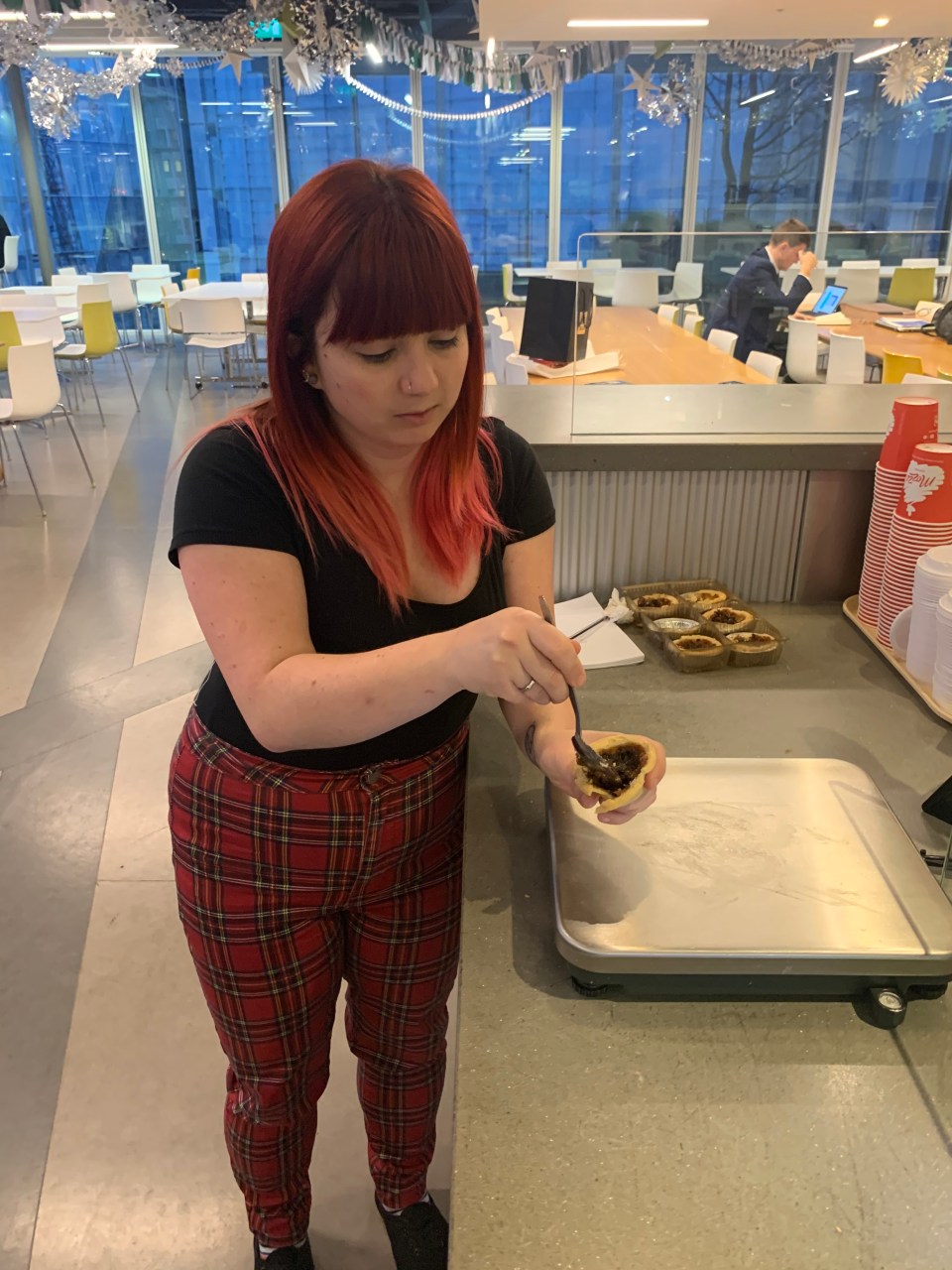  Sun reporter Levi Winchester scooping out the mince pie filling