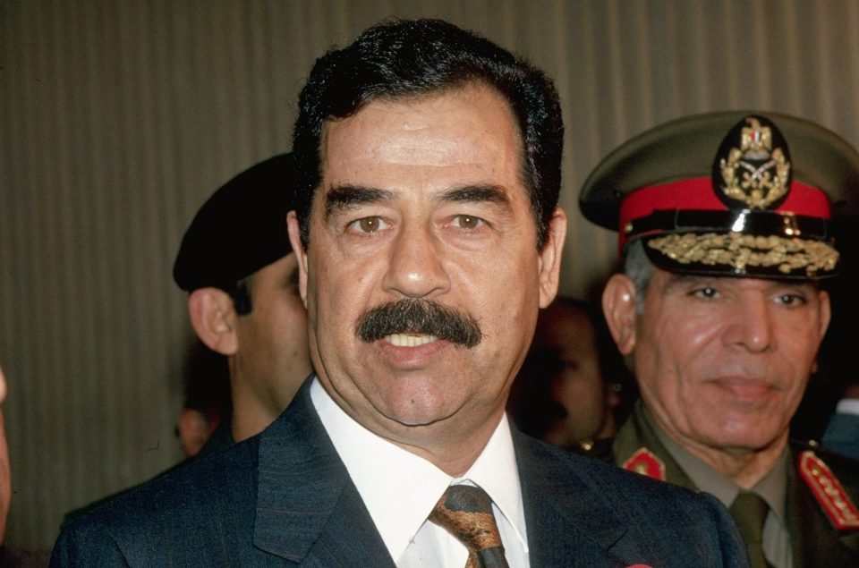  Dead despot Saddam Hussein, pictured with Def. Min. Gen. Youssef Abu Taleb