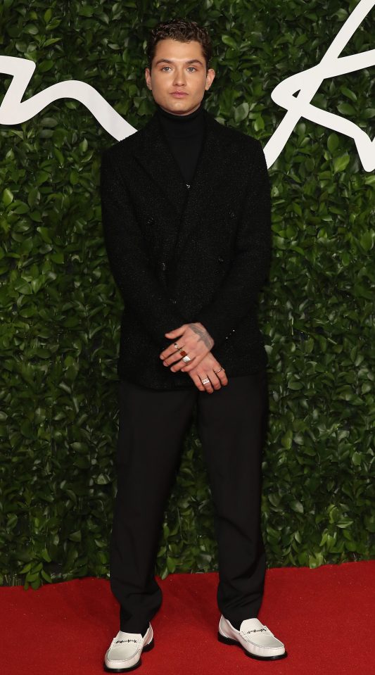 Rafferty opted for a black turtleneck, black trousers and white loafers