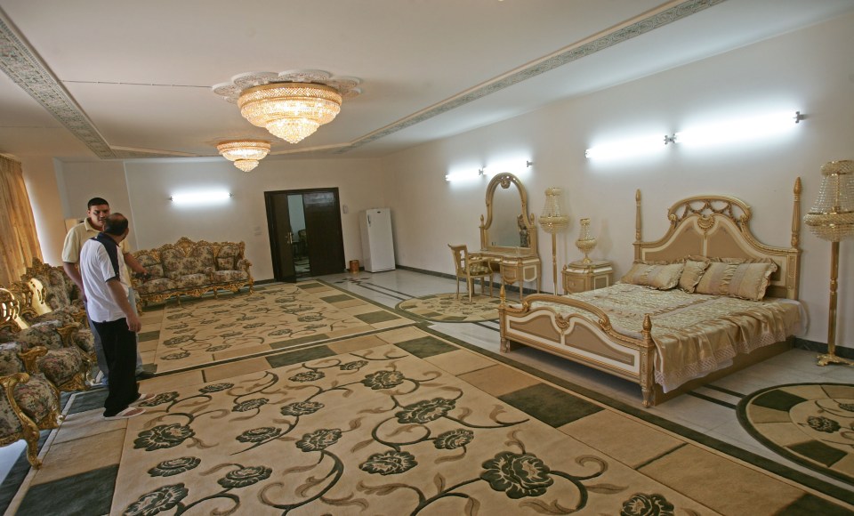  Inside a marbled room, where Saddam supposedly once slept, at one of the former dictator's palace villas