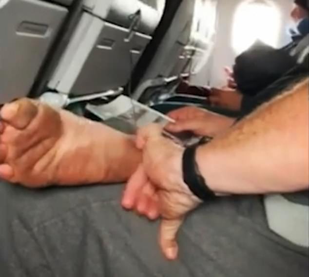 One man was spotted picking his feet