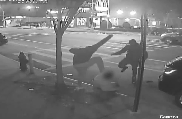 Security camera footage showed a man on the ground being viciously attacked during the mugging