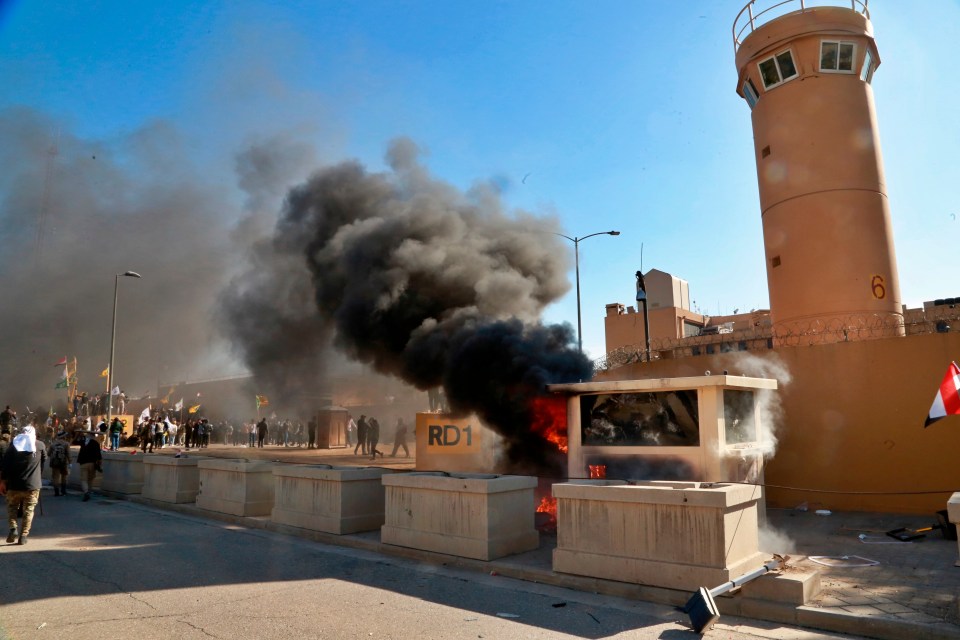 The thugs surged inside the outer part of the heavily fortified embassy compound