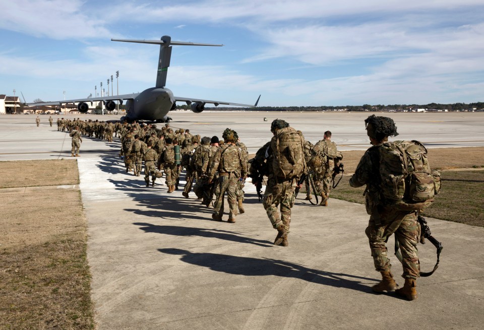 First troops head to Iraq as Trump vows to make Iran pay for embassy riot