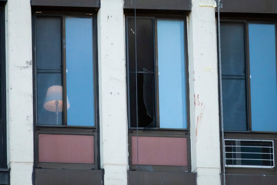 Newell cut a hole in this window inside the 11th story apartment in Chicago