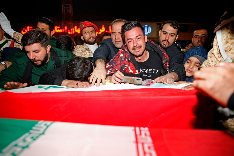 The casket was greeted by chants of 'Death to America' as Iran issued new threats of retaliation