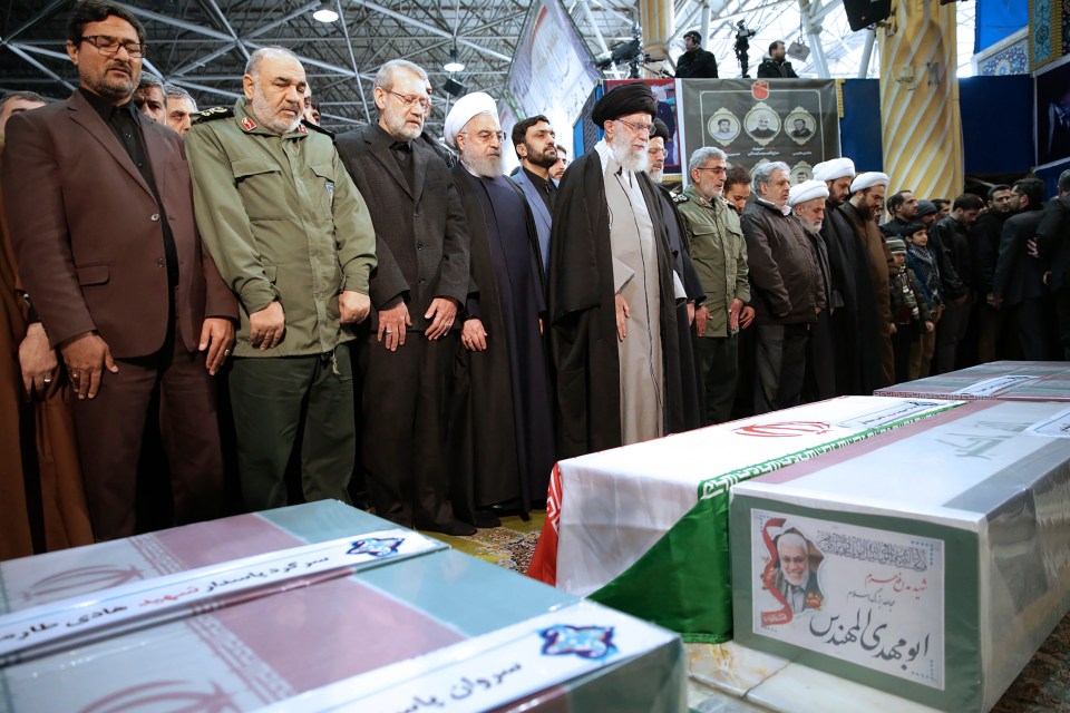  Iran's Supreme Leader Ayatollah Ali Khamenei and Iranian President Hassan Rouhani pray over the coffins