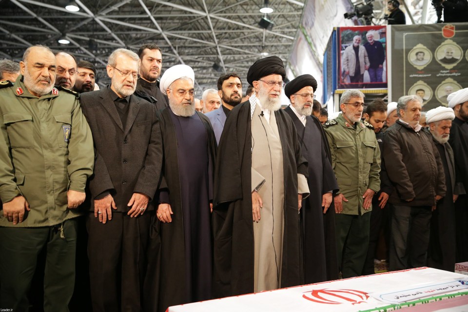  Iranian Supreme Leader Ayatollah Ali Khamenei (C) praying before the coffins