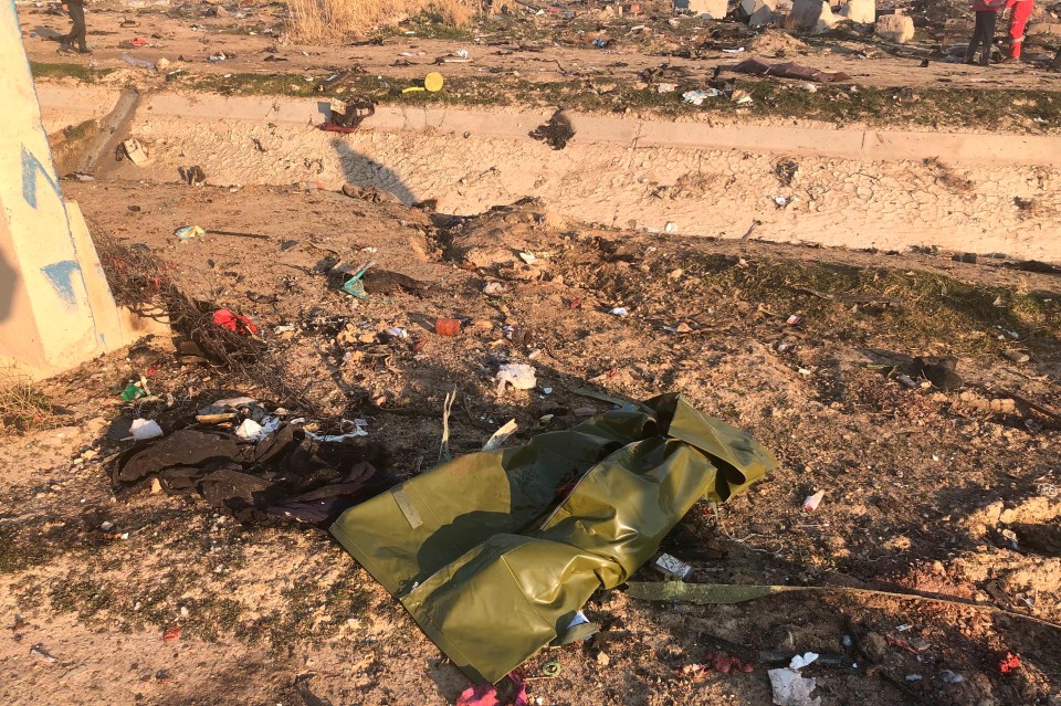 Debris is seen following the aftermath of the crash near Tehran