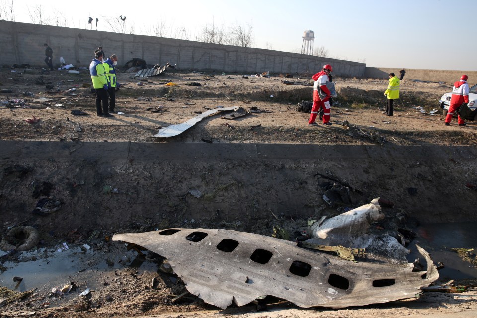  Wreckage could be seen strewn across the ground in a field near the airport