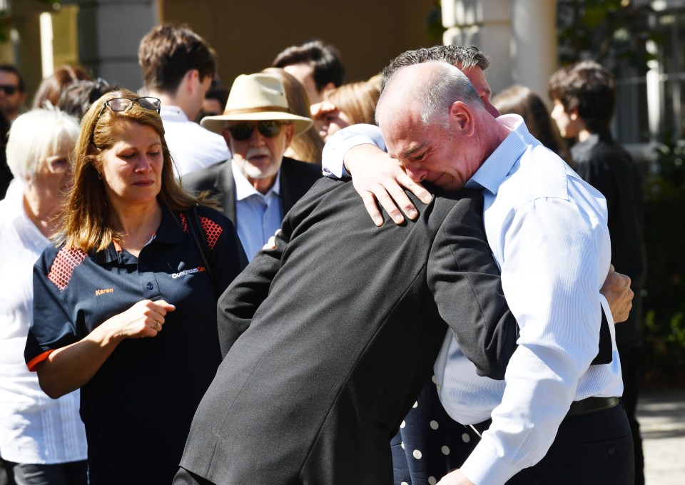  Emotional friends and family of Dick and Clayton paid their respects to the heroic father and son