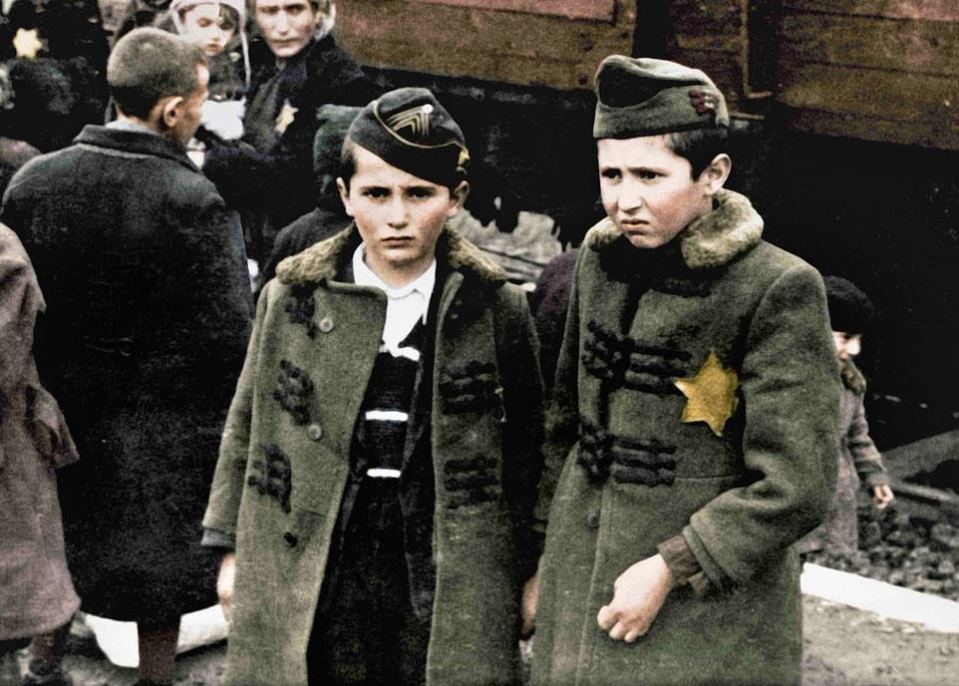 Two boys arrive at the death camp after being sent on a train from their homes
