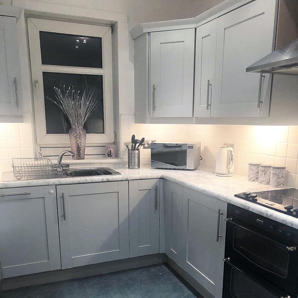 But after a fresh lick of paint and using Fablon to cover the work surfaces, it looks like a completely different kitchen