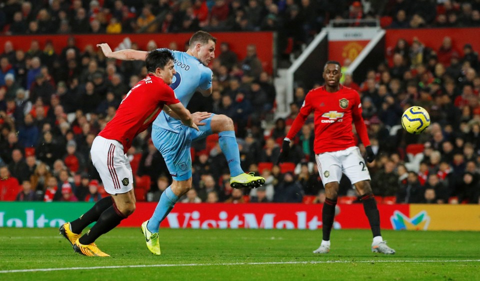  Chris Wood beat Harry Maguire to flick home the opening goal