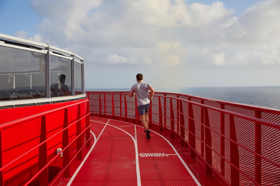 Guests can work out on The Runway, a jogging track around the top deck