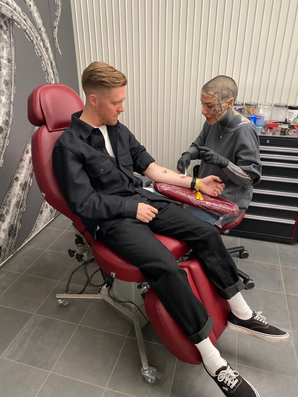  Sun man Jacob checks out the liner's on board tattoo parlour