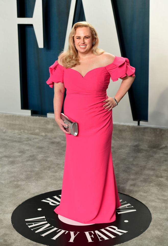 Actress Rebel Wilson stood out in a vibrant pink gown