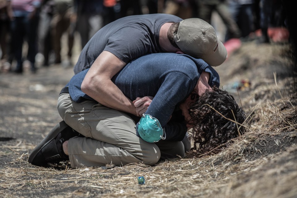 Relatives react at the scene where the Ethiopian Airlines Boeing 737 Max 8 crashed shortly after takeoff 