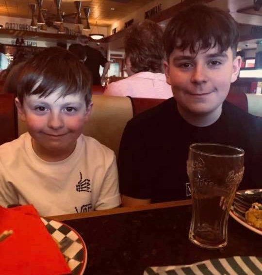  Carson had been helping Coby, left,  with homework just hours before his death