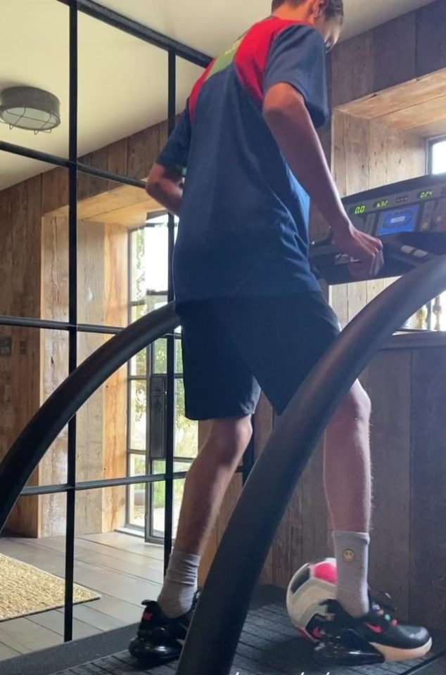  Romeo showed off his football skills on a high-tech treadmill while an impressed Posh filmed it all