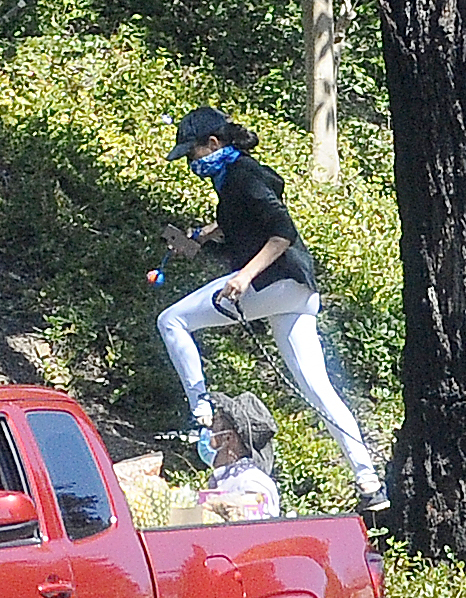  Meghan Markle was seen wearing shades, a baseball cap, white trousers and a black top