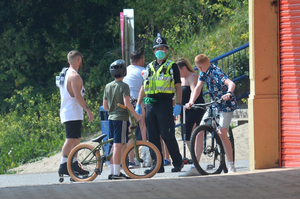 Police speak to youngsters on bikes in Barry Island, Wales
