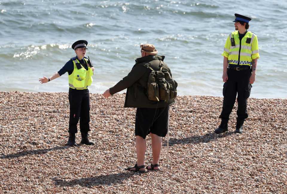  Police officers patrol the beach in Brighton as the UK continues in lockdown to help curb the spread of the coronavirus