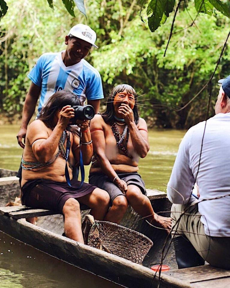 The tribeswomen playing with the camera