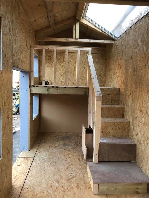 The two-storey playhouse even has a garage attached