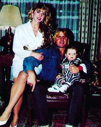  Owen Hart, pictured with wife Martha and one of his two children, tragically died after falling from the roof at a WWE PPV in 1999