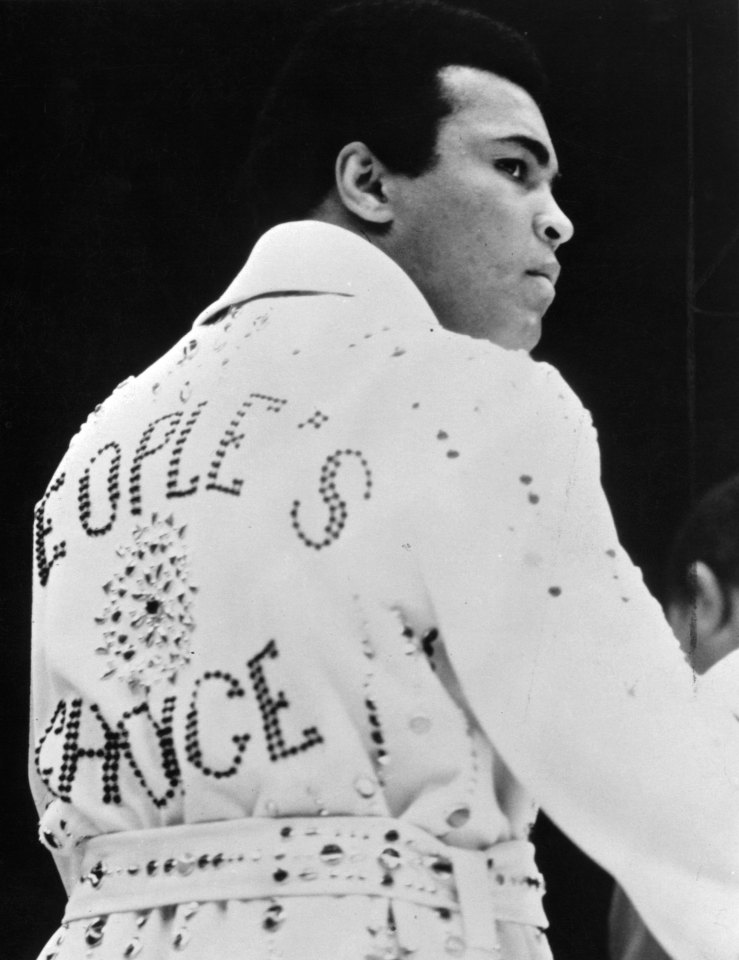  Ali wears a cape reading "People's Choice" given to him by Elvis before his fight against Joe Bugner in 1973