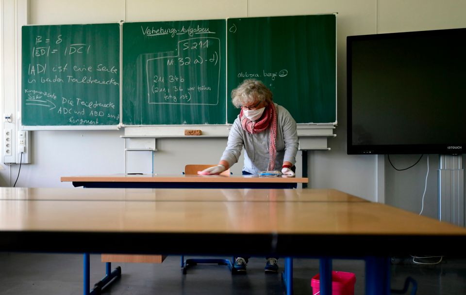  A teacher in Dortmund, Germany disinfects a classroom before schools reopened on May 7