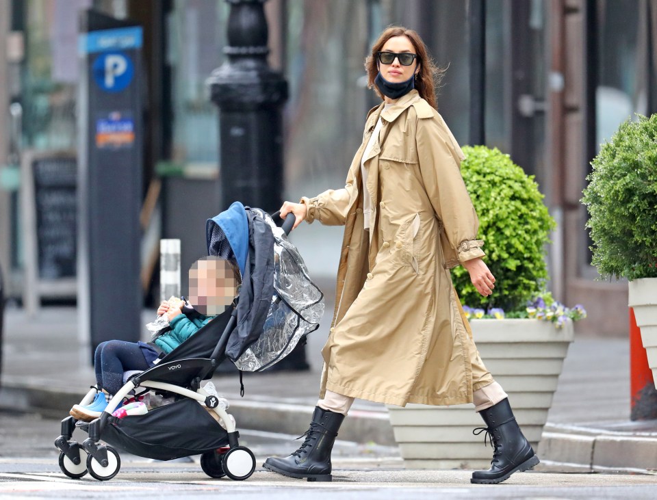 The model wowed in a beige trench coat and black rain boots while out for a stroll in New York City