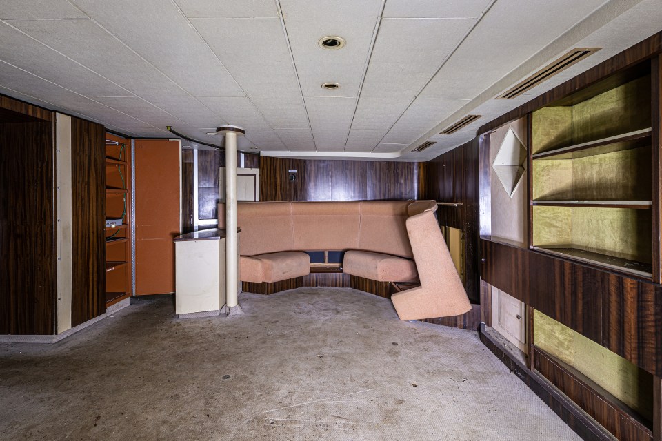 A partly dismantled sofa in a large living area on board