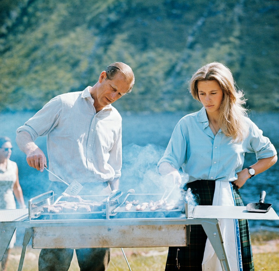 The Duke of Edinburgh and Princess Anne preparing a barbecue on the Estate at Balmoral Castle, Scotland during the Royal Family's annual summer holiday, 22nd August 1972