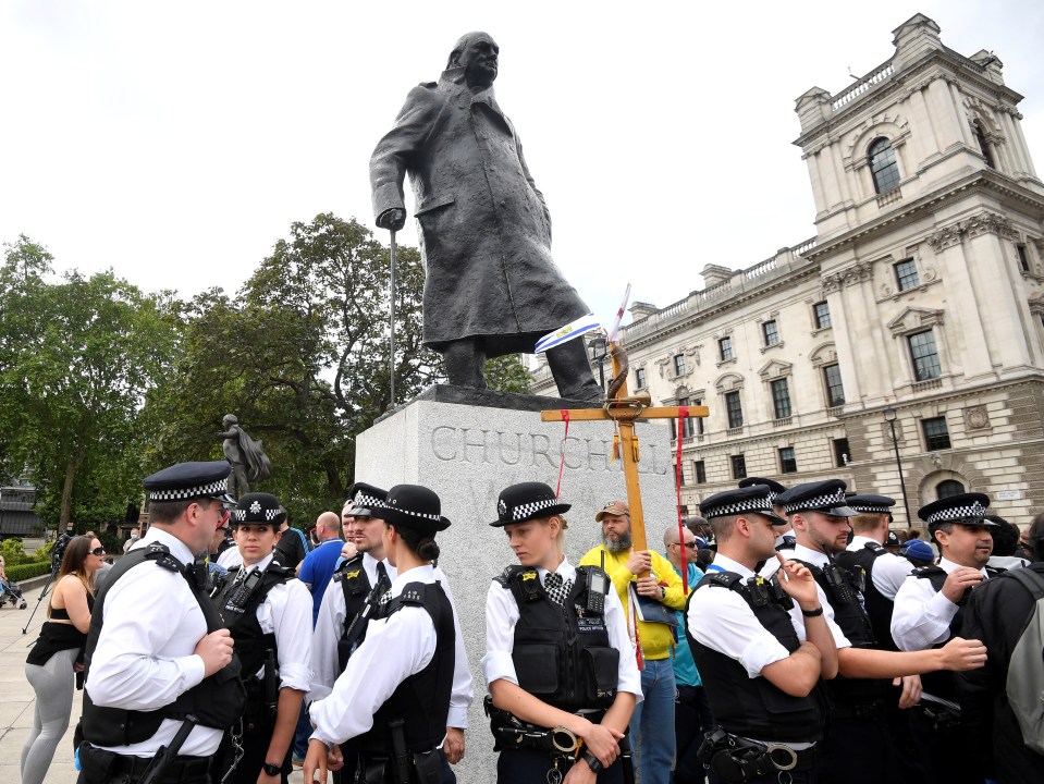 Police form a ring of steel around the statue of Winston Churchill in Parliament Square