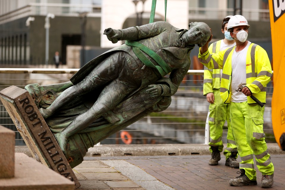 The statue of slaver Robert Milligan was removed by workmen in East London last night