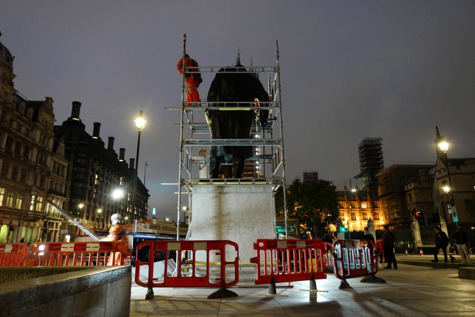 The Winston Churchill statue in Westminster being covered up ahead of weekend demonstrations