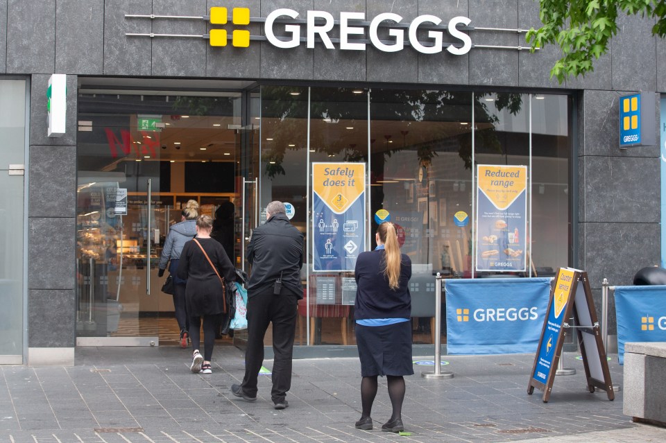 Customers queue up outside a reopened Greggs store in Liverpool